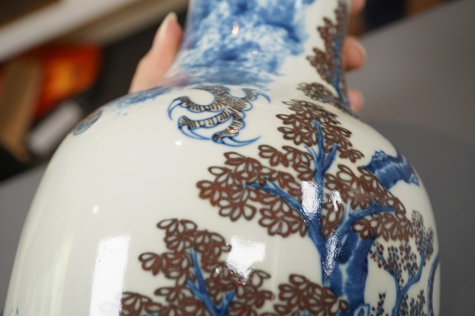 A Chinese underglaze blue and copper red ’dragon and tiger’ baluster vase, possibly 19th century